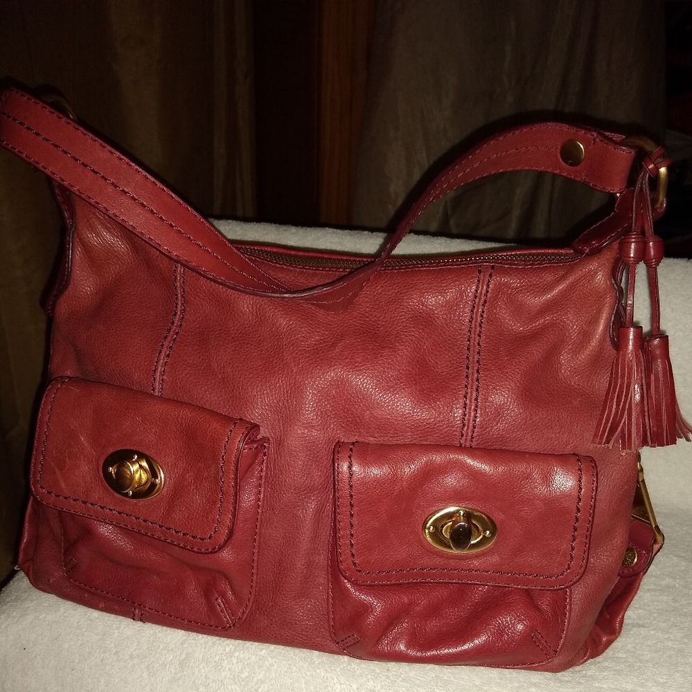 The Sak burgundy leather turnlock pockets satchel.